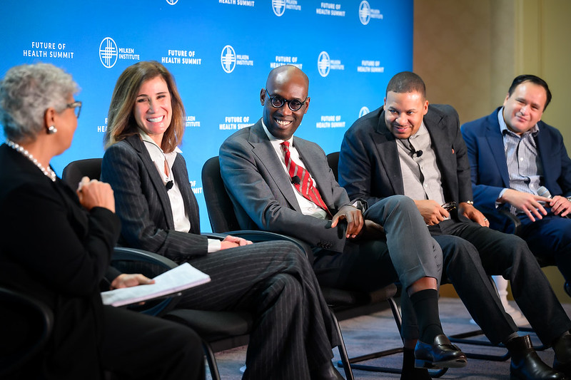 Jennifer Byrne seated onstage with fellow panelists at the Milken Institute Future of Health Summit