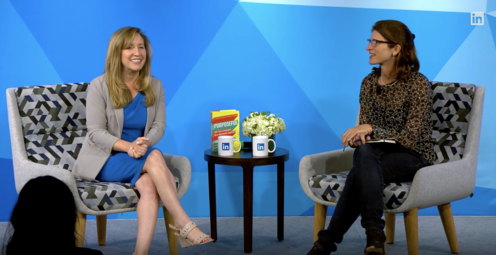 Jennifer Dulski, seated at left in a blue dress and gray jacket, discusses Purposeful at a LinkedIn event.