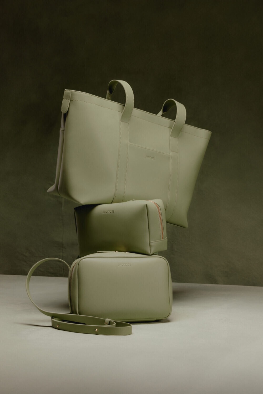 Cactus-green tote, toiletry case and crossbody bag from the Monos x Sincerely Jules collection