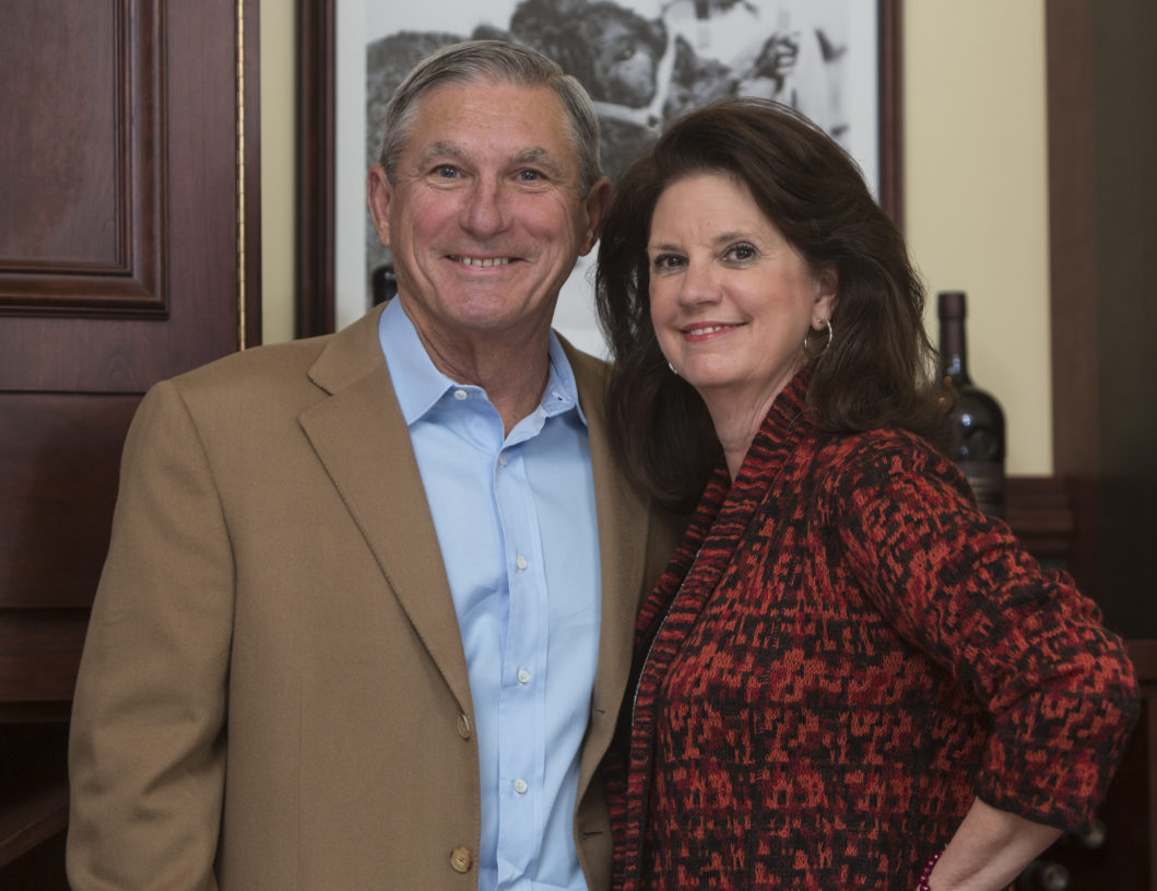 Jerry and Judy Kent standing together at a dinner for their Olin scholarship students