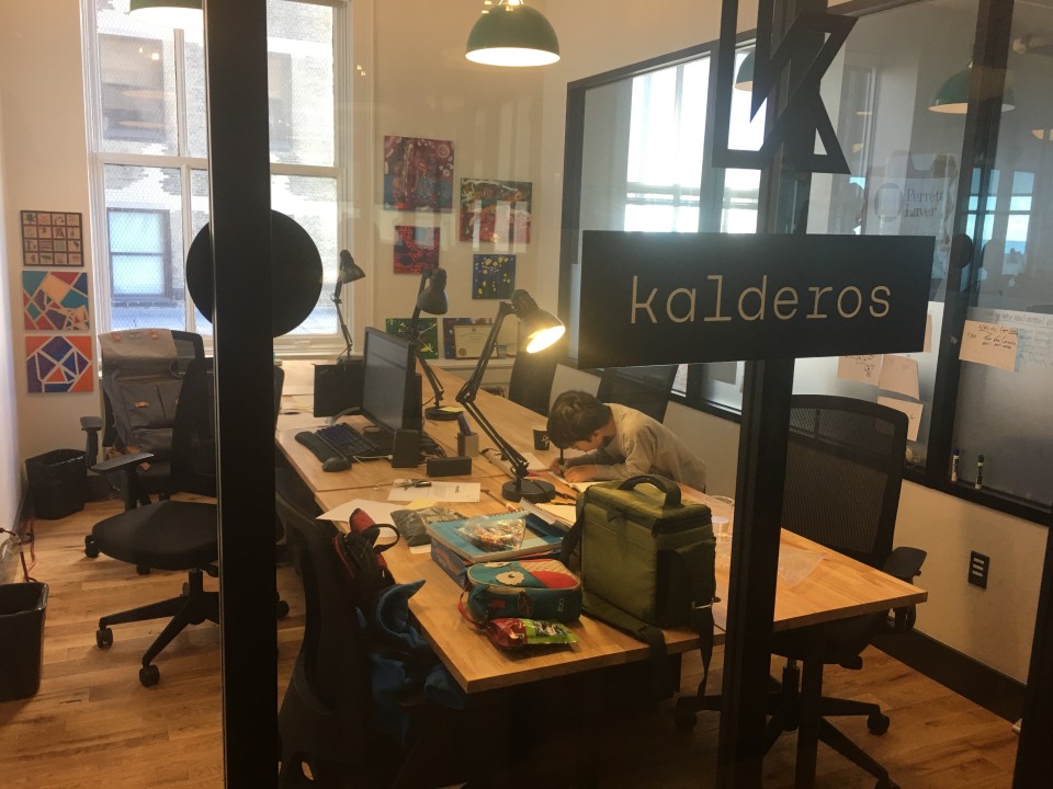 Kalderos’s first office, with Docken’s son drawing at a shared desk