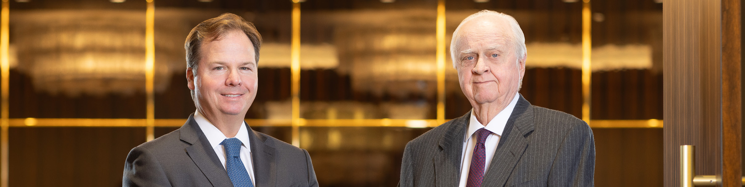 Jeremy Ford, left, and Gerald J. Ford in a photograph published in Hilltop's company brochure