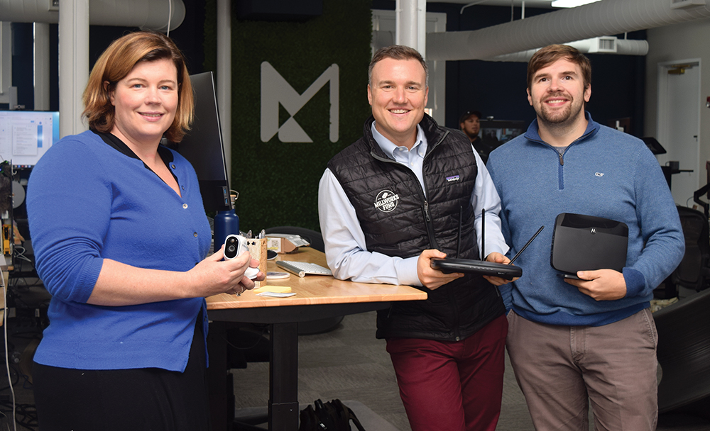 Liz Hitchcock, Gray Chynoweth and Jeremy Hitchcock standing together at Minim