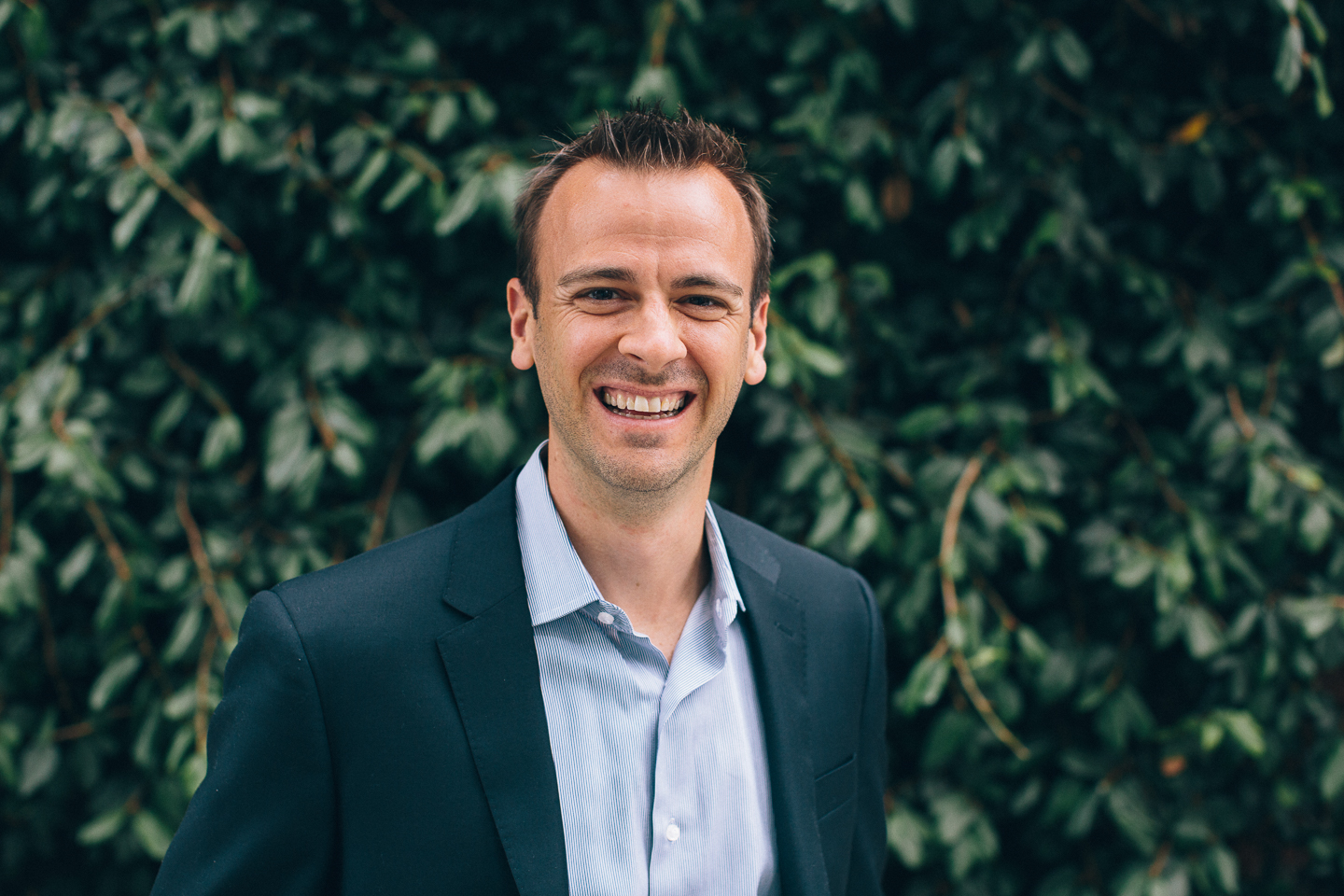 Jeremy Swift outdoors in a jacket and open-collar shirt