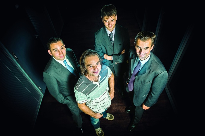 The original Quartz Bio team looking up toward the camera in 2012