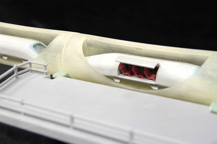 WhiteClouds' 2013 scale model of the Hyperloop, with clear tubes and small passenger pods