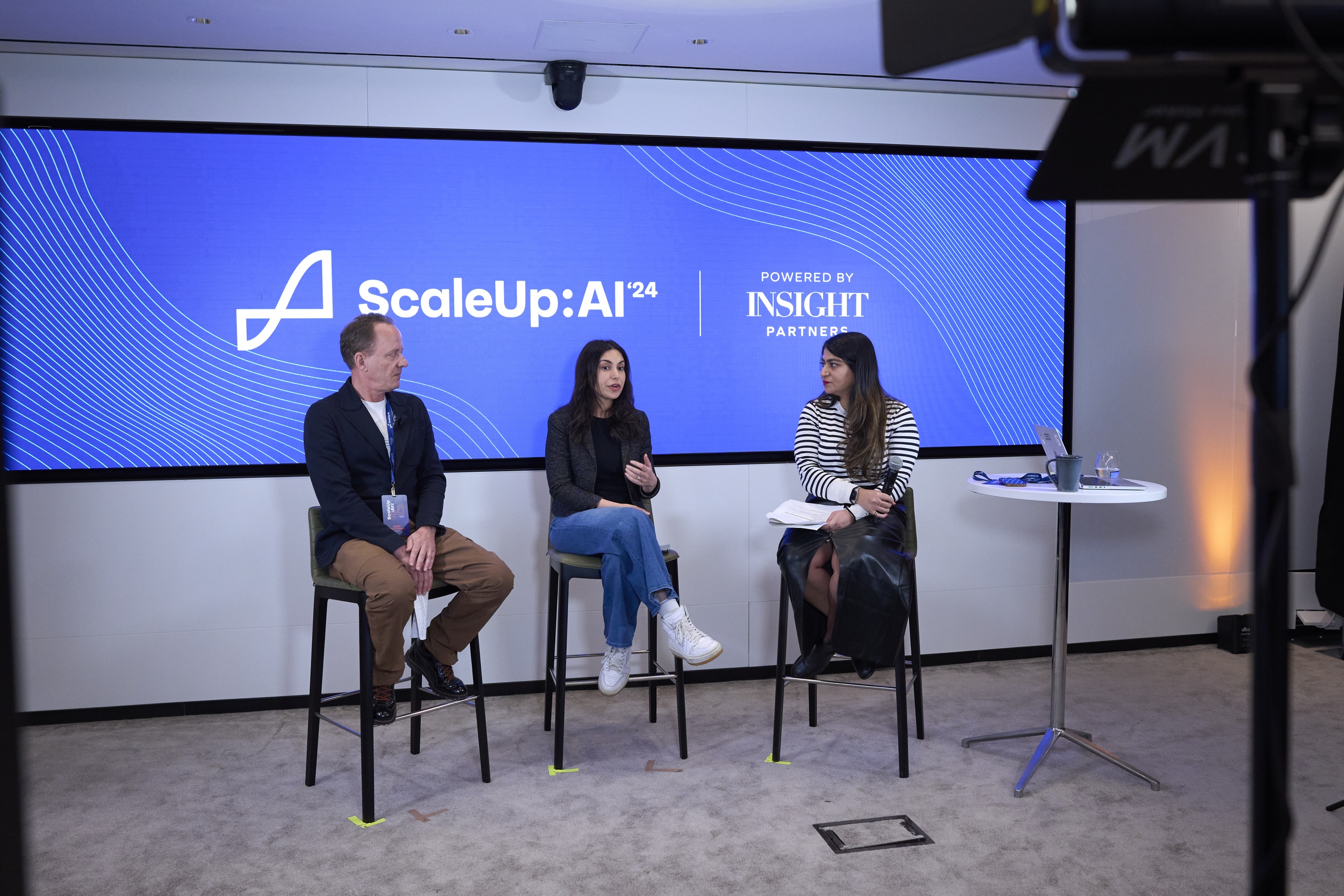 Jesper Theill Eriksen, left, onstage with May Habib and Tanya Dua at ScaleUp:AI 2024