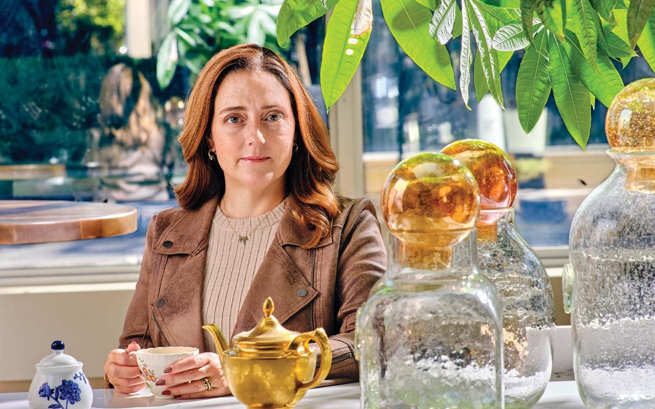 Jessica Cordova Kramer holding a teacup at the Lynhall in Minneapolis