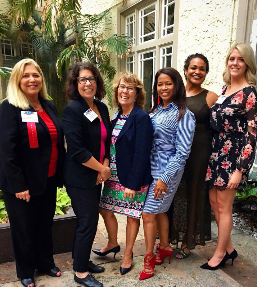 Six Quest colleagues at a TEAMFL meeting, with Jessica Francois at far right