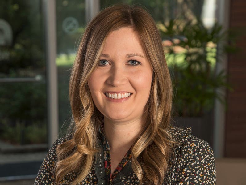 Jessica Kirk seated indoors during her OfficeSpace Software era