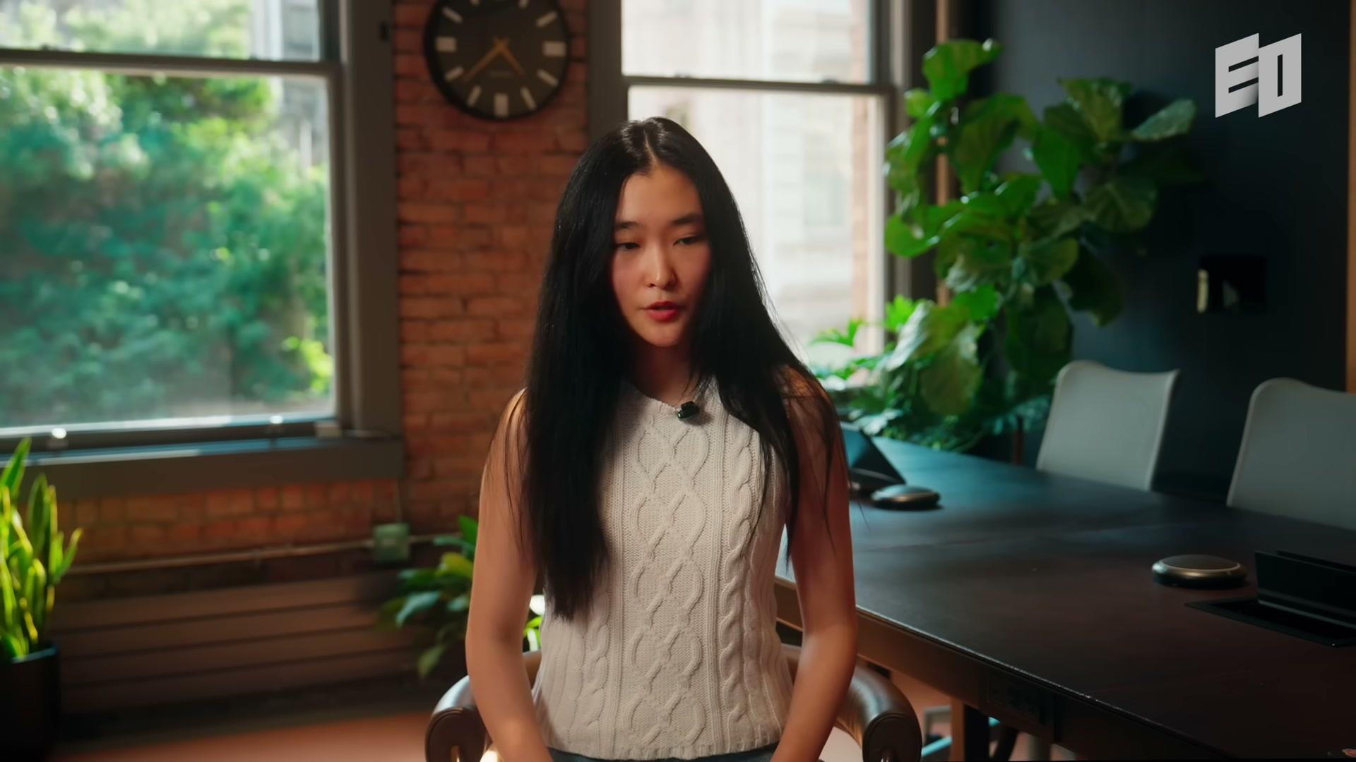 Jessica Wu seated beside a conference table during her EO interview