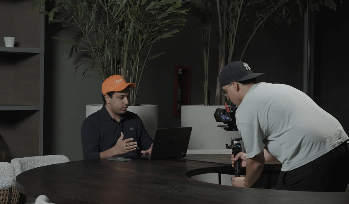 Jesus Castillo seated at a table during a filmed interview in Caracas