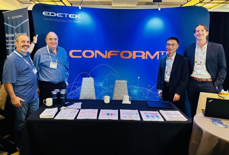 Four EDETEK colleagues, including Jian Chen second from right, at the CONFORM exhibition booth at DPHARM 2023
