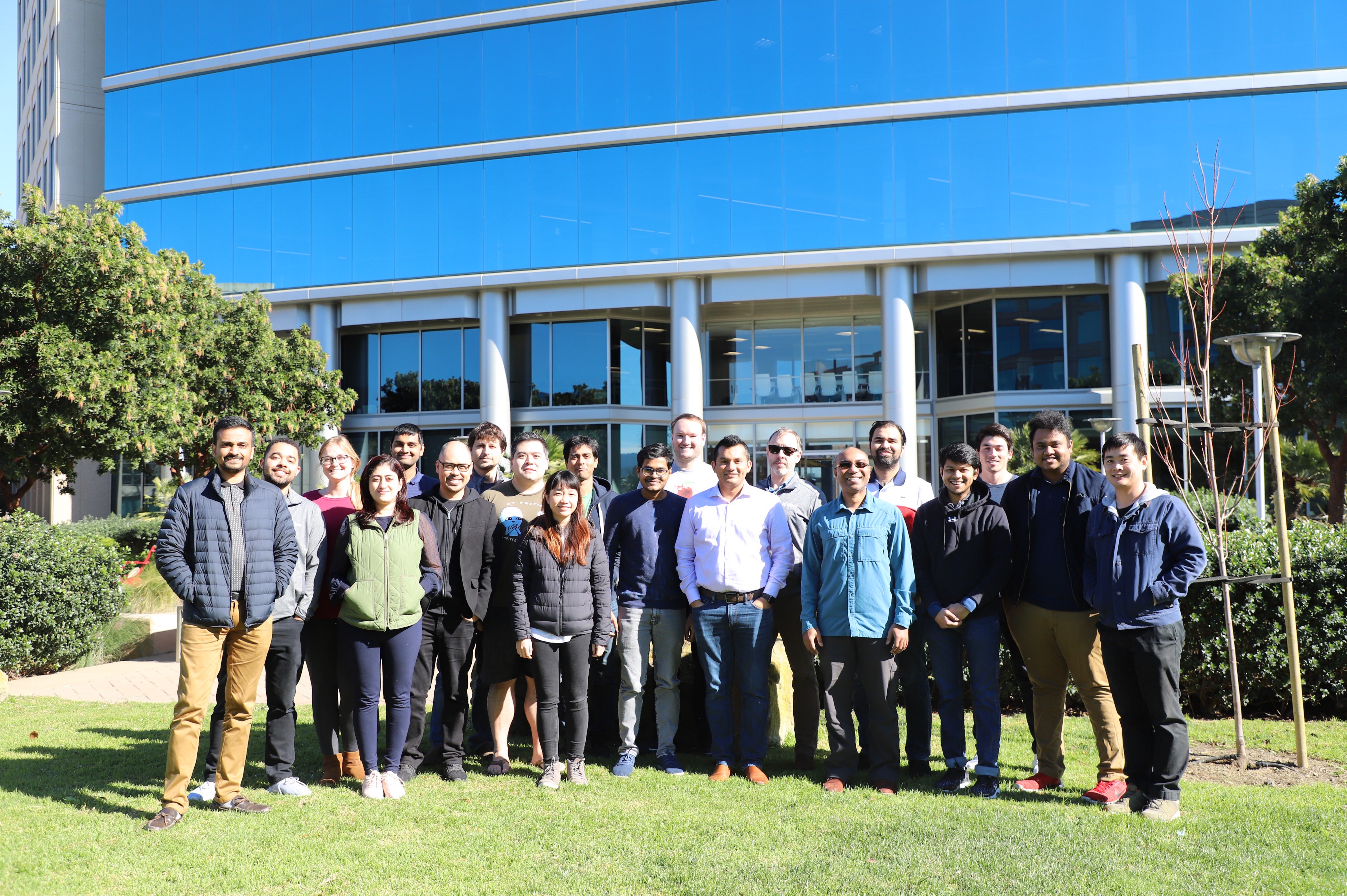 The Miles team standing together outside an office building