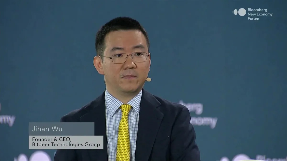 Jihan Wu seated onstage at the 2025 Bloomberg New Economy Forum in Singapore