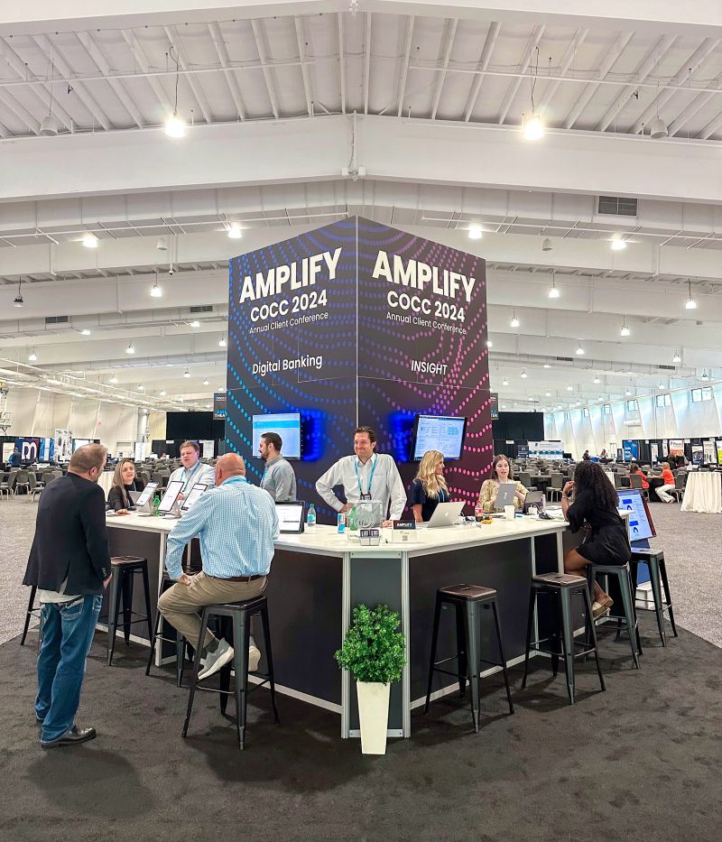 The central digital-banking and INSIGHT pavilion at COCC's 2024 AMPLIFY client conference, surrounded by attendees