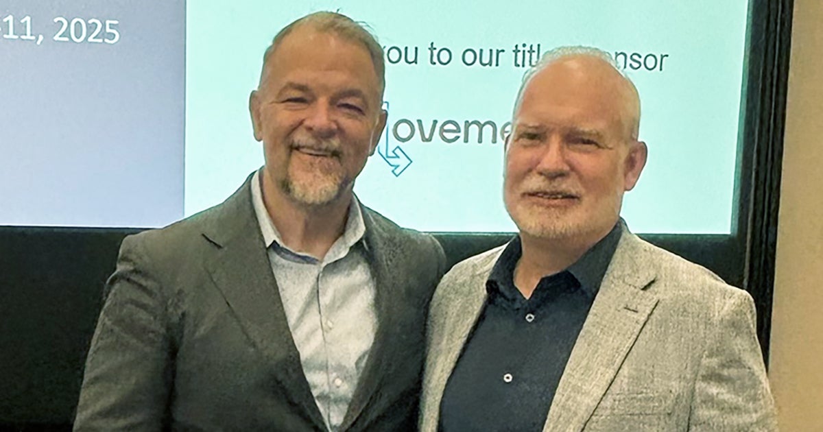 Jim Boyle, left, standing with Dan Hurry at a June 2025 supply-chain council event