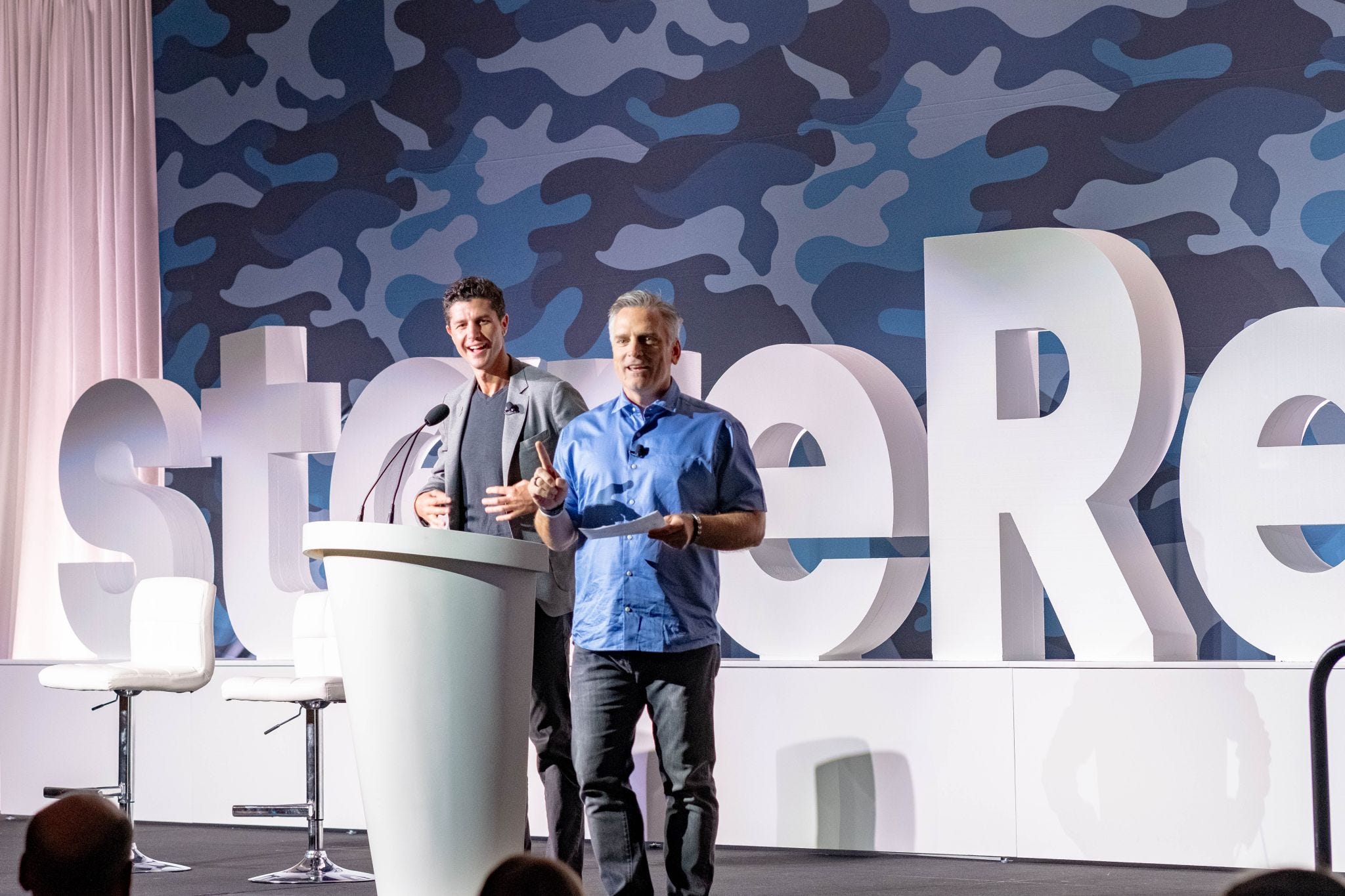 Jim Donnelly, right, speaking onstage at a Restore event with another presenter