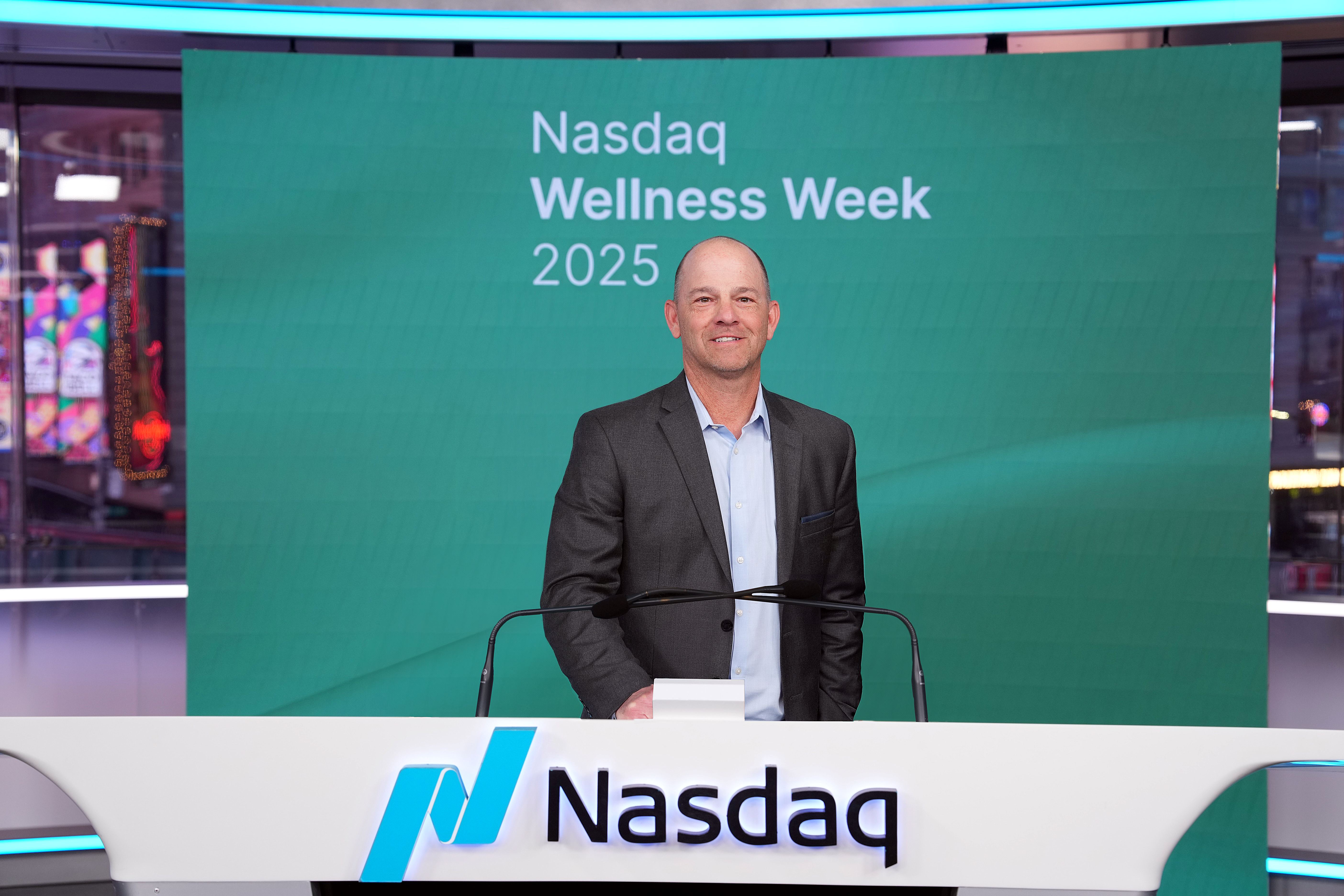 Jim Pisani behind the Nasdaq lectern in New York in 2025