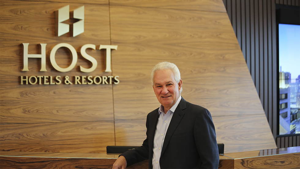 Jim Risoleo standing at the reception desk in Host Hotels and Resorts’ Bethesda headquarters