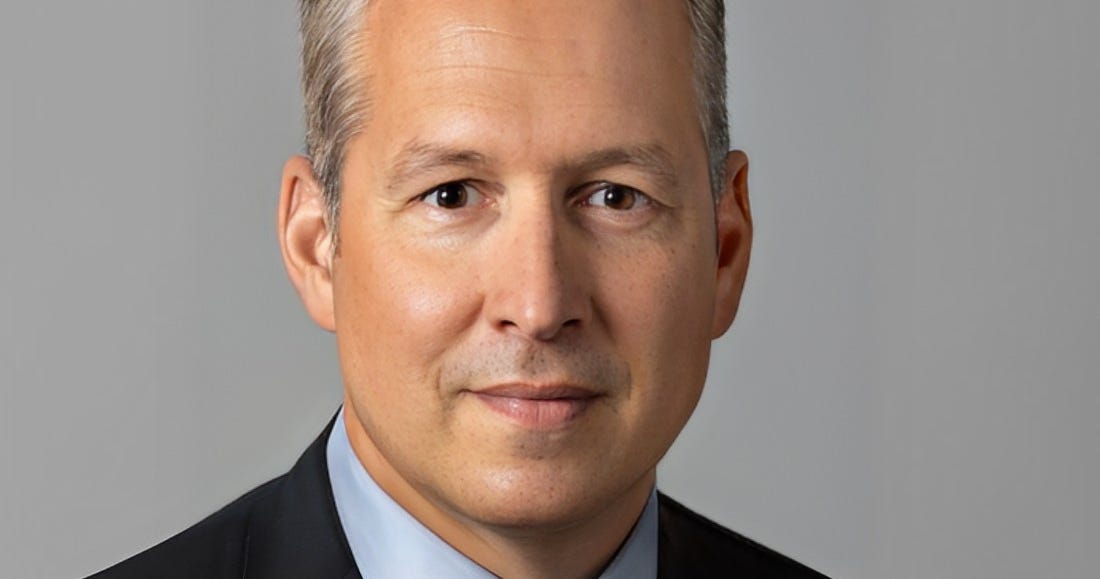 Jim Robinson in a formal executive portrait
