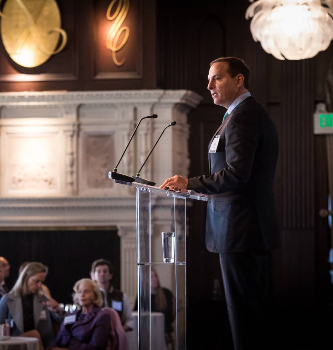 Jim Tananbaum speaking at a lectern in a room with an audience