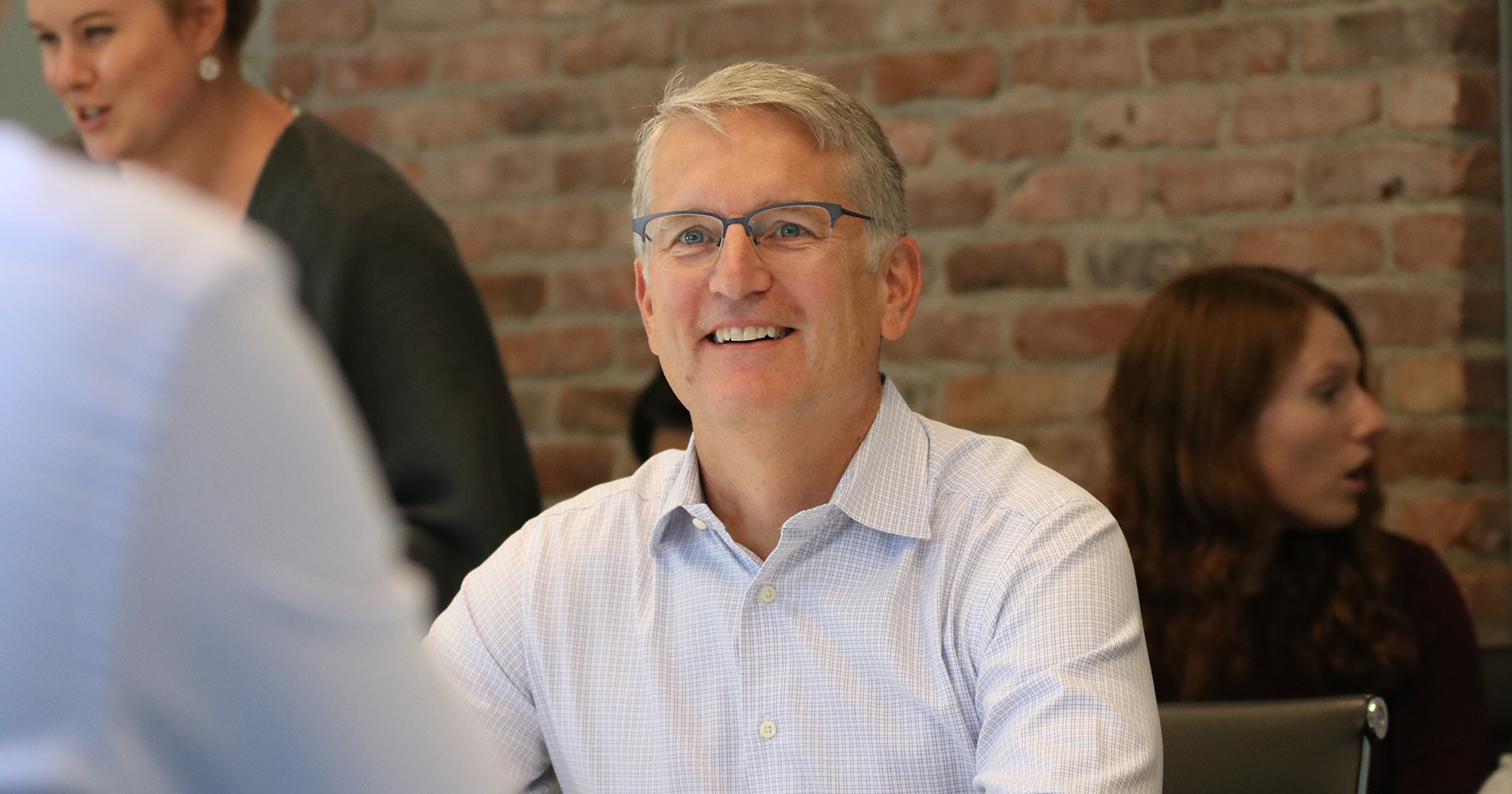 Jim Taylor listening at a Brixmor all-employee meeting