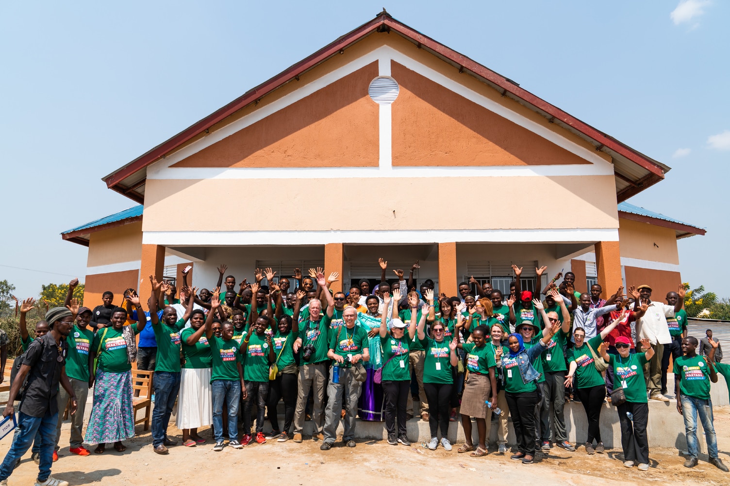 A group gathered outside the Nakivale library at its opening