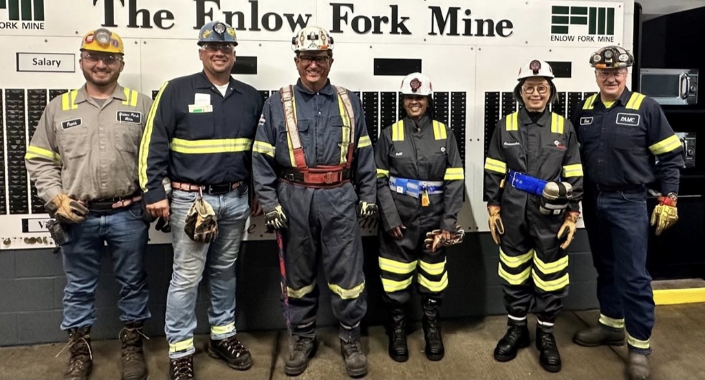 Jimmy Brock with colleagues in mining clothes and hard hats at the Enlow Fork Mine