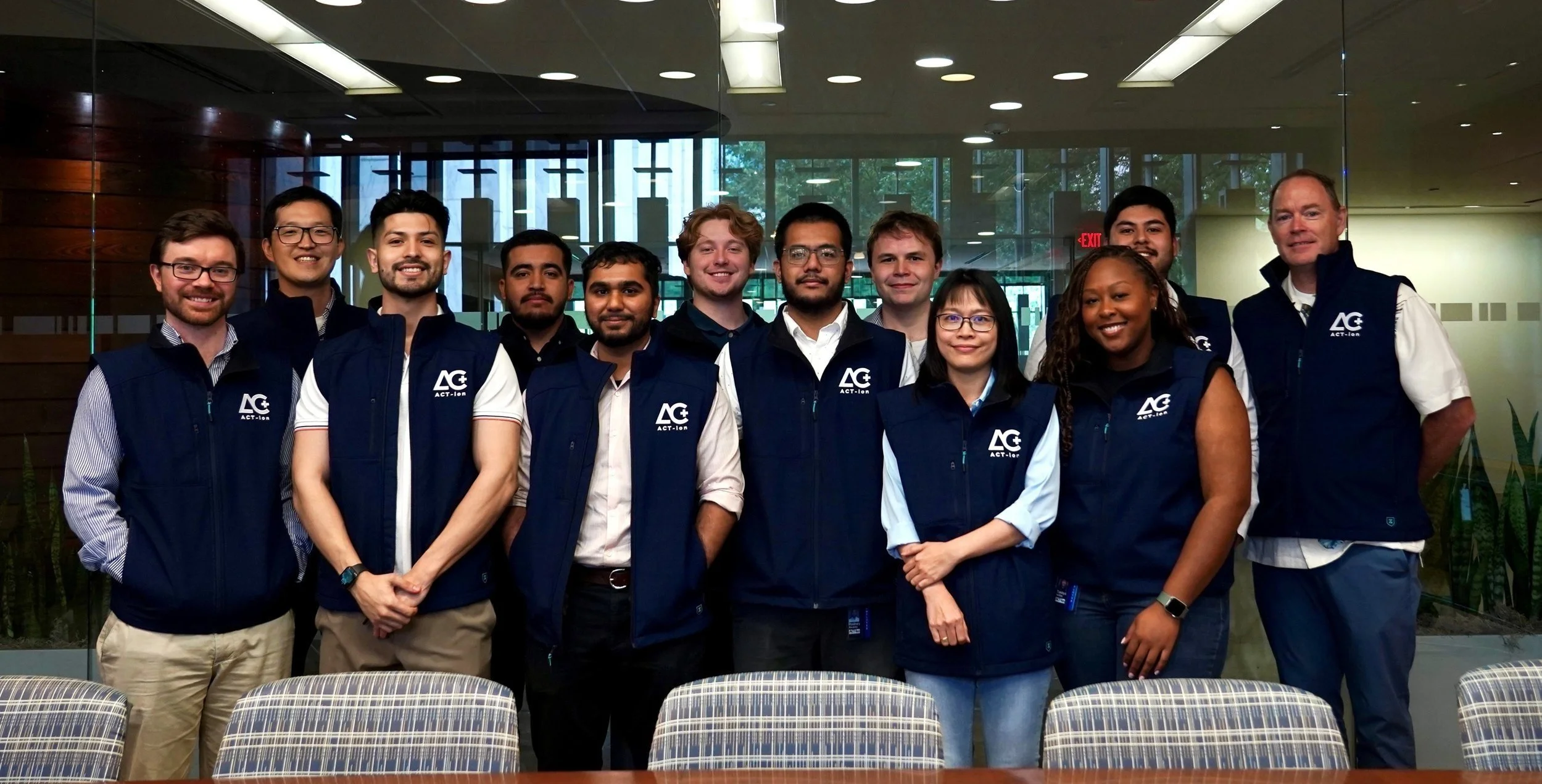 Jin-Myoung Lim pictured with ACT-ion colleagues in matching navy company vests