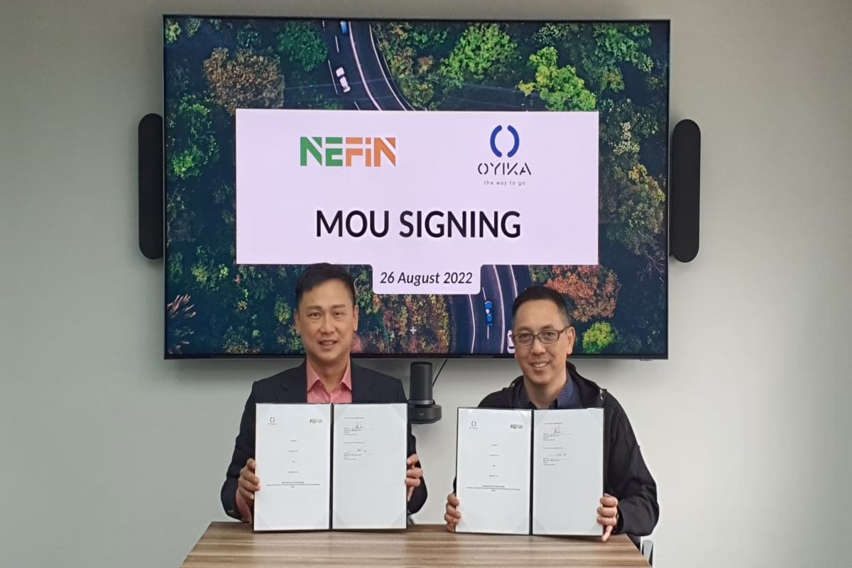 Jinsi Lee, right, and a NEFIN representative holding their partnership documents