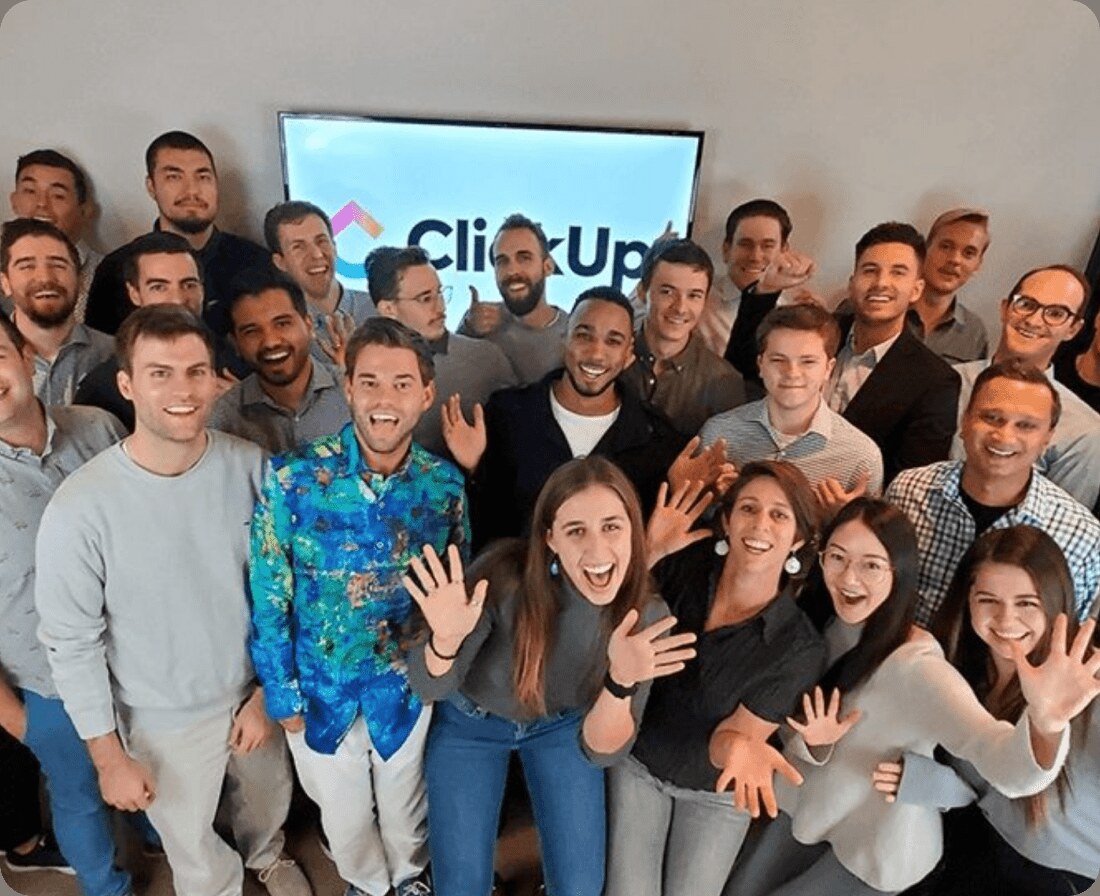 ClickUp employees gathered together in an office