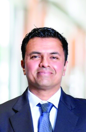 Jitesh Shetty in a suit and tie