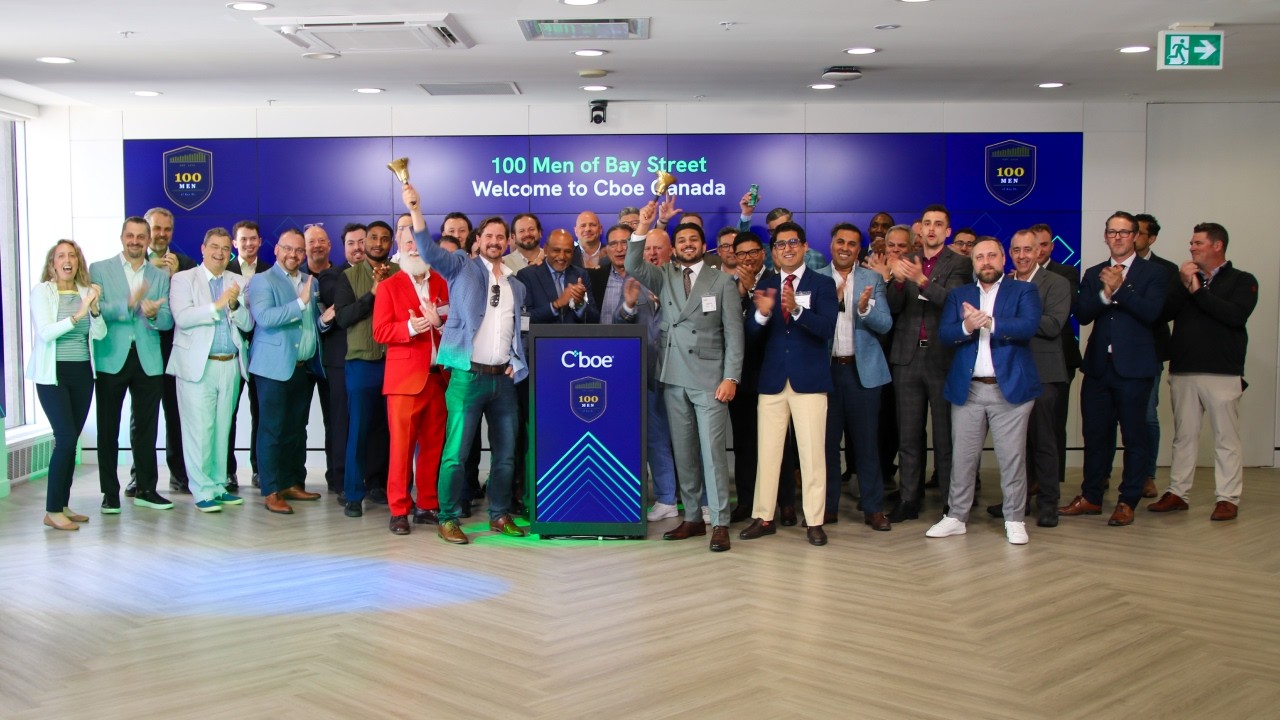 Attendees celebrate at the 100 Men of Bay Street gathering hosted at Cboe Canada