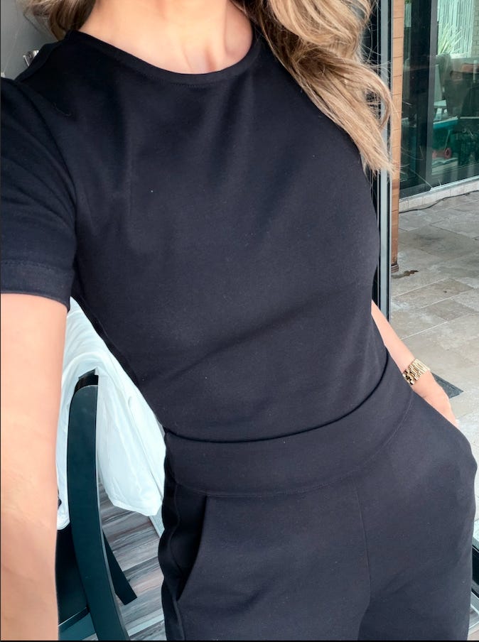 Joanna Lord wears a black prototype of the Ginger jumpsuit by NEON PALM