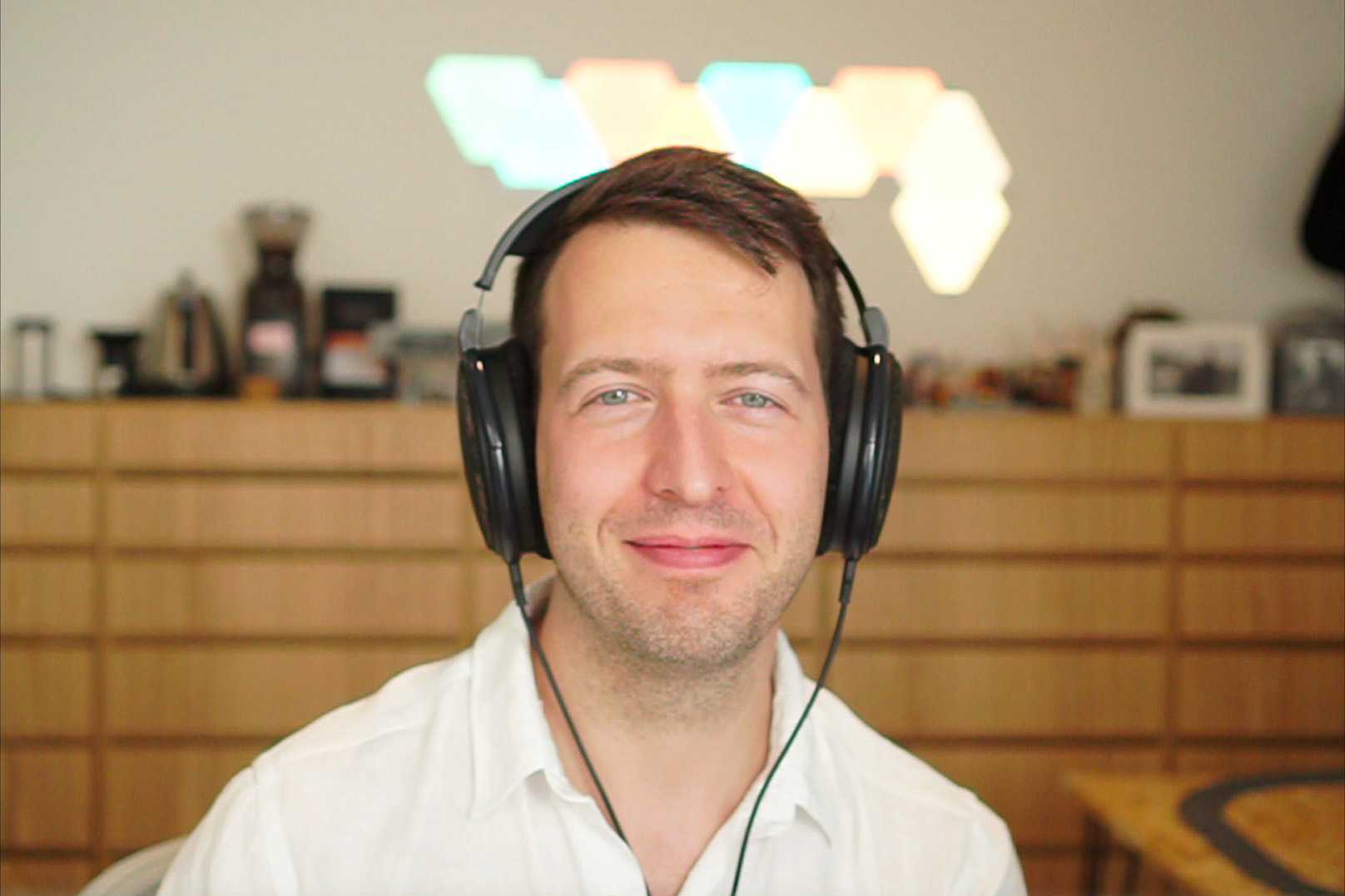 Job van der Voort wearing headphones in his home office