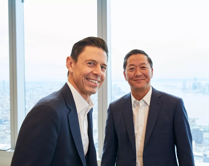 Scott Nuttall on the left and Joe Bae on the right, standing together at KKR