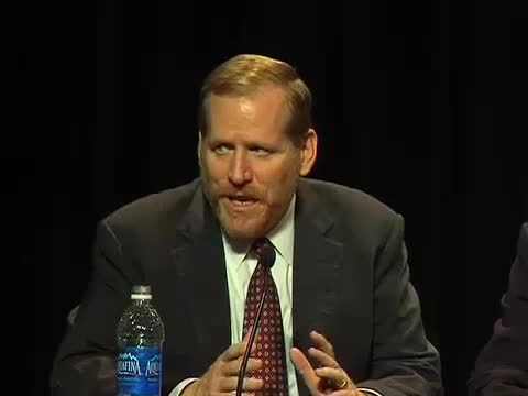 Joe McGuire speaking during a business panel discussion