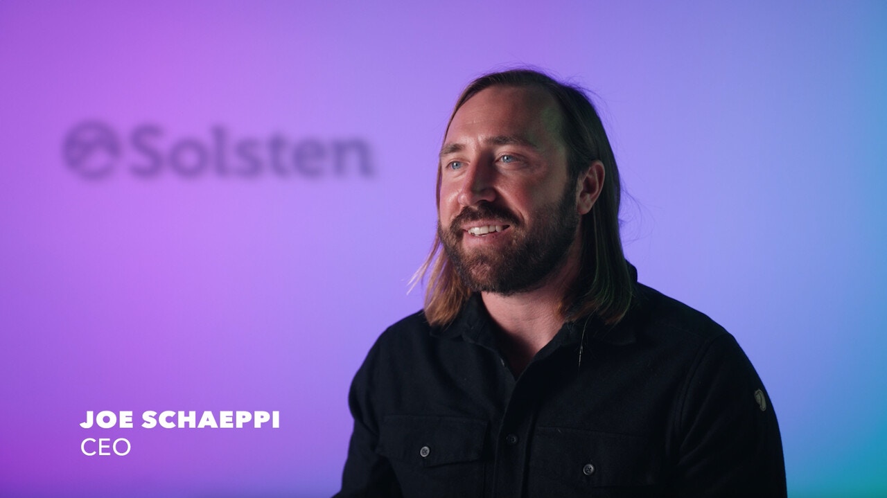 Joe Schaeppi speaking in a Solsten interview against a purple and blue background