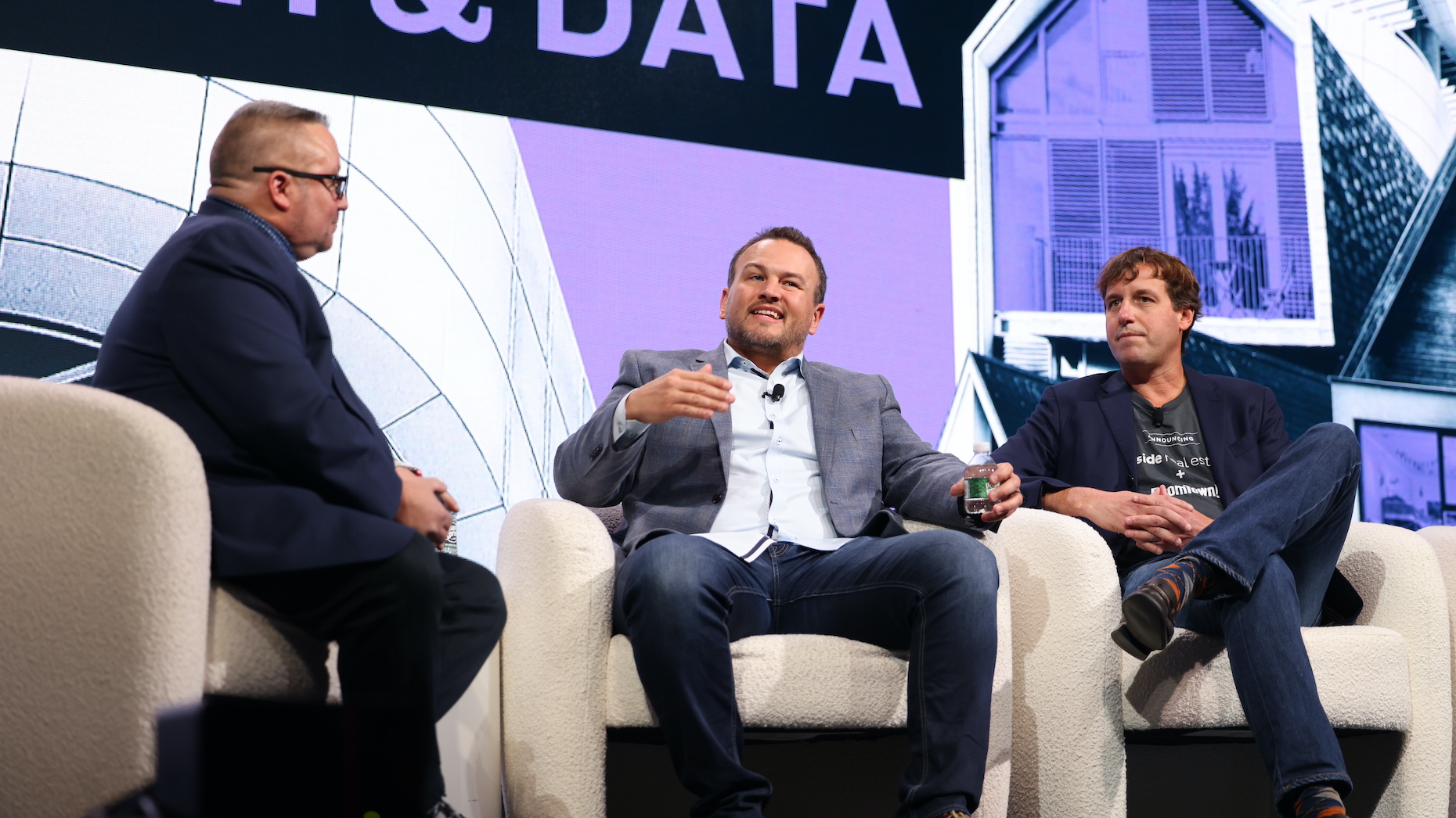 Moderator Jeff Lobb, Joe Skousen and Grier Allen seated onstage at Inman Connect New York in January 2023.