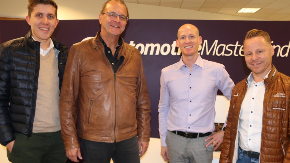Johannes Gnauck, second from right, with Tim Wilke, Ralph M. Meunzel and Andreas Reiser in front of an automotiveMastermind display.
