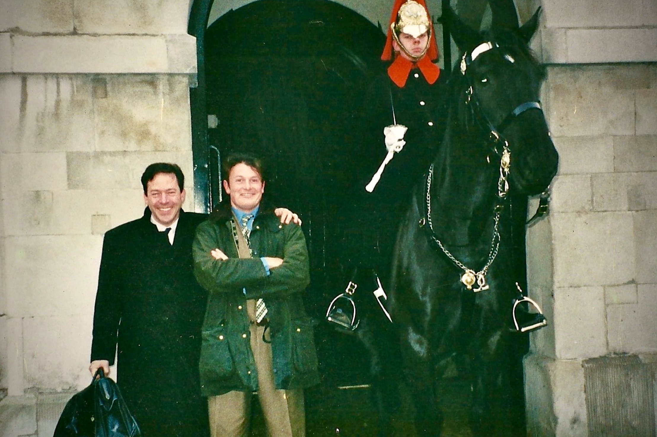 John Phillips and a companion standing beside a mounted ceremonial guard in London