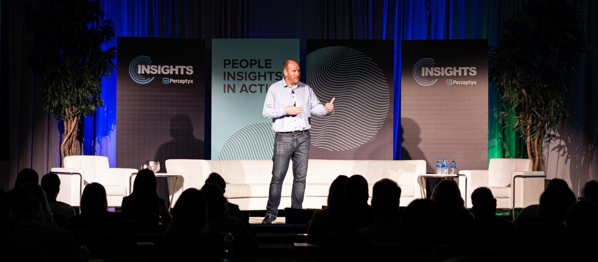 John Borland speaking onstage at the Perceptyx INSIGHTS conference