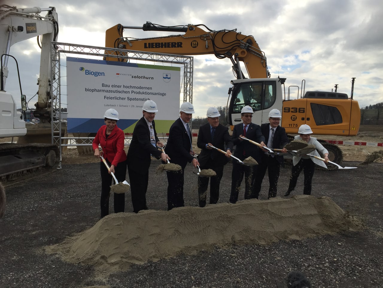 John Cox, third from left, joins officials and Biogen leaders with shovels at the Luterbach groundbreaking in January 2016.