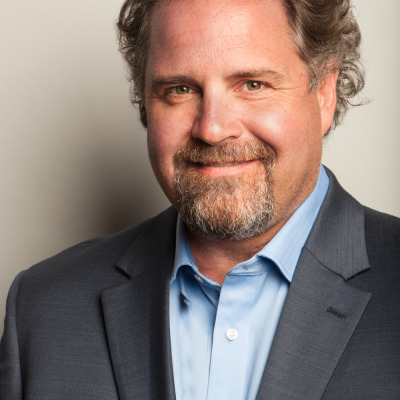 John Derham in a formal portrait from his iQ Media period