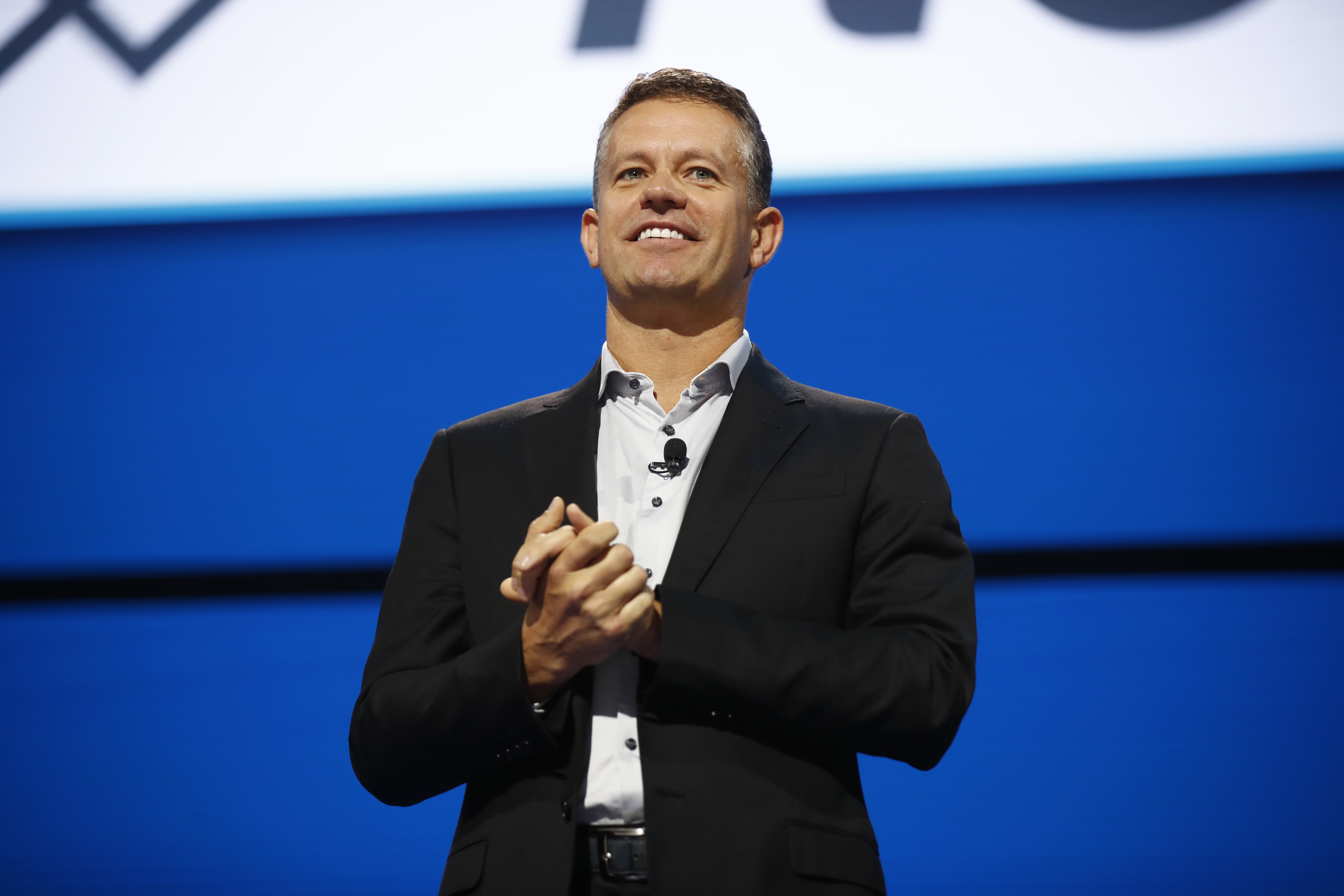 John Furner speaking onstage at Walmart’s 2019 associate and shareholders meeting