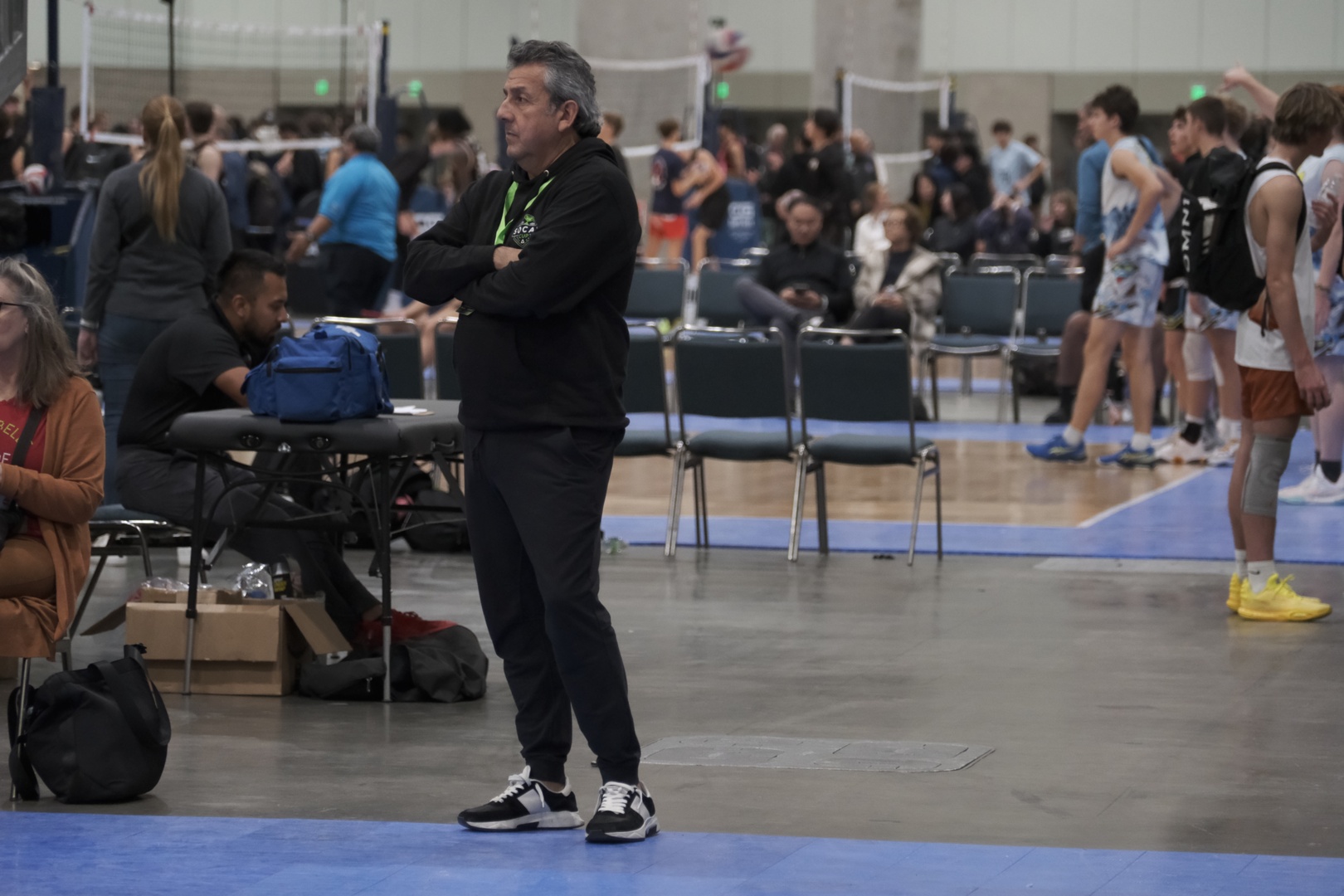 John Gallegos watches volleyball from the sidelines at the Los Angeles Convention Center.