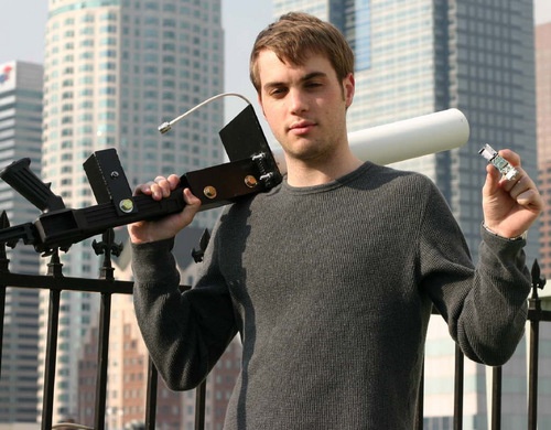 John Hering holding the BlueSniper wireless research device