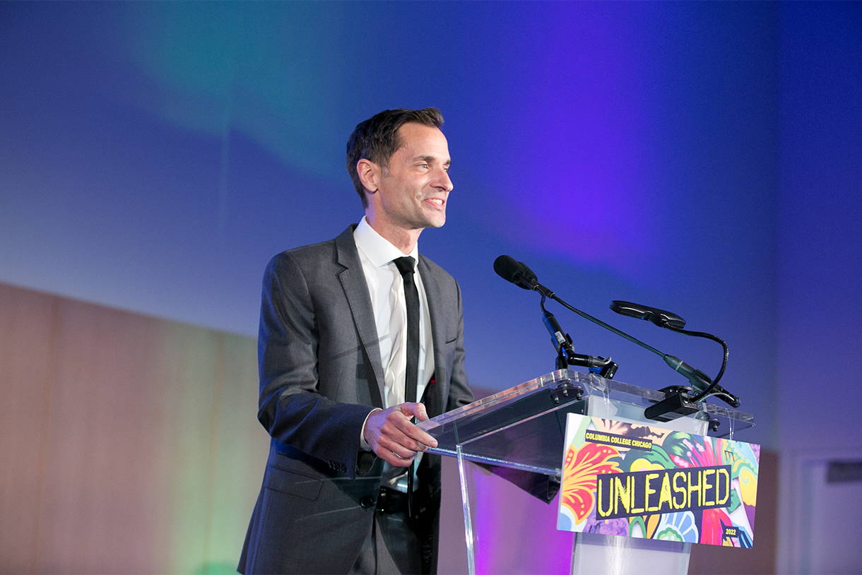 John Holmes speaking at a lectern during Columbia College Chicago’s Unleashed 2022 gala