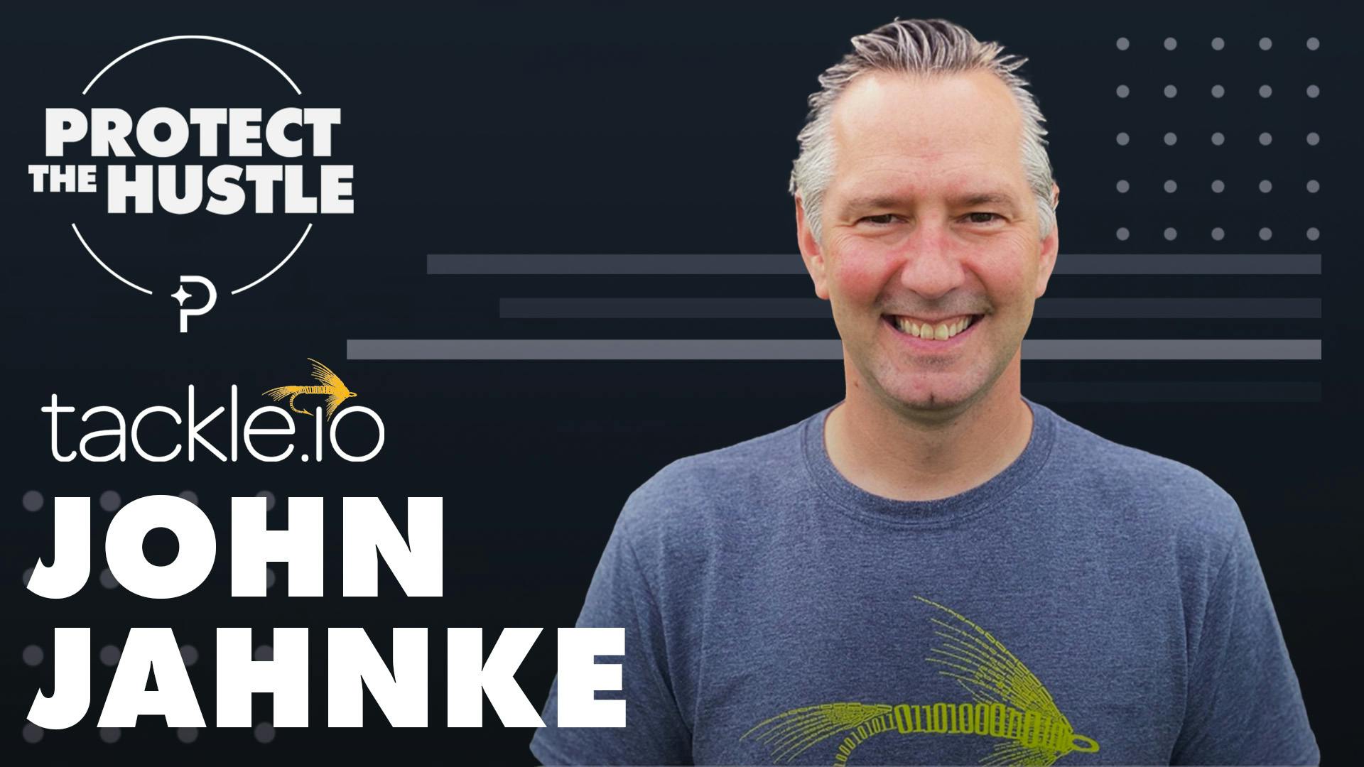 John Jahnke smiling in a Tackle T-shirt for a podcast conversation about capital efficiency